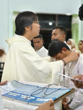 Fr. Herbert Magbuo, Superior of the Mission Station in Indonesia, receives the postulants during the Rite of Acceptance.
