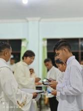 Fr. Herbert Magbuo, Superior of the Mission Station in Indonesia, receives the postulants during the Rite of Acceptance.