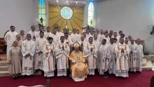 With the priests and deacons concelebrants.