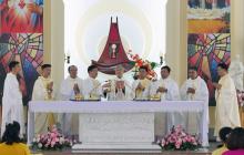 Eucharistic celebration with the new priests at the altar.
