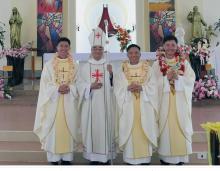 The three newly ordained Rogationist priests with Bishop Dominic of Dalat.
