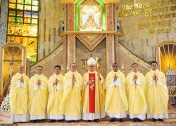 The seven new priests with the Bishop, after the Mass of ordination.
