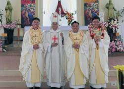 The three newly ordained Rogationist priests with Bishop Dominic of Dalat.