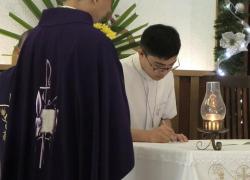 Bro. Gabriel Motol signing the formula of first profession, while Fr. Orville Cajigal, the Superior of St. Matthew Province, witnesses it. 